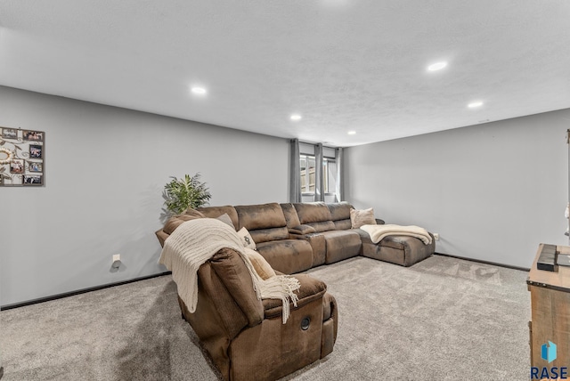 carpeted living area featuring recessed lighting and baseboards