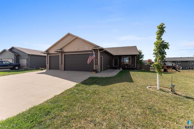 single story home with concrete driveway, a front yard, and an attached garage