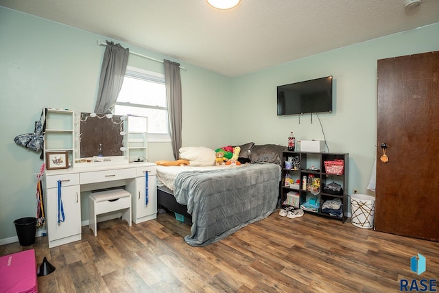 bedroom featuring wood finished floors