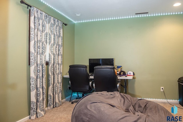 office with carpet floors, baseboards, and visible vents