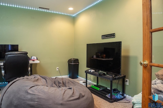 carpeted office space with baseboards, recessed lighting, and visible vents