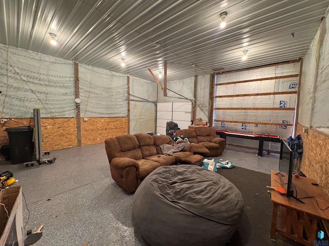 living room featuring a garage and speckled floor