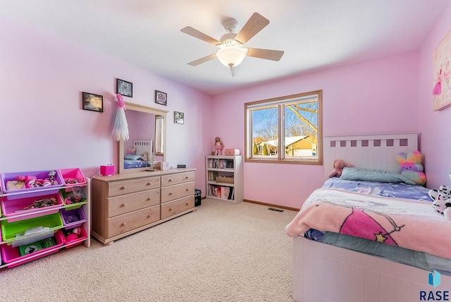 bedroom featuring visible vents, a ceiling fan, and carpet flooring