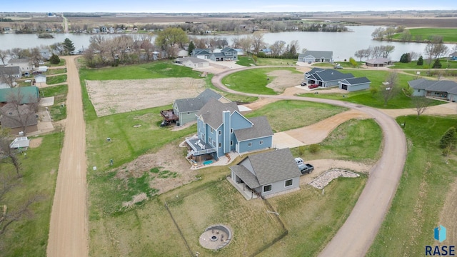 aerial view featuring a water view and a residential view