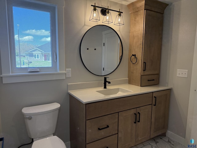 301 W 2nd St, Marion, SD 57043 - bathroom with baseboards, toilet, vanity, and marble finish floor