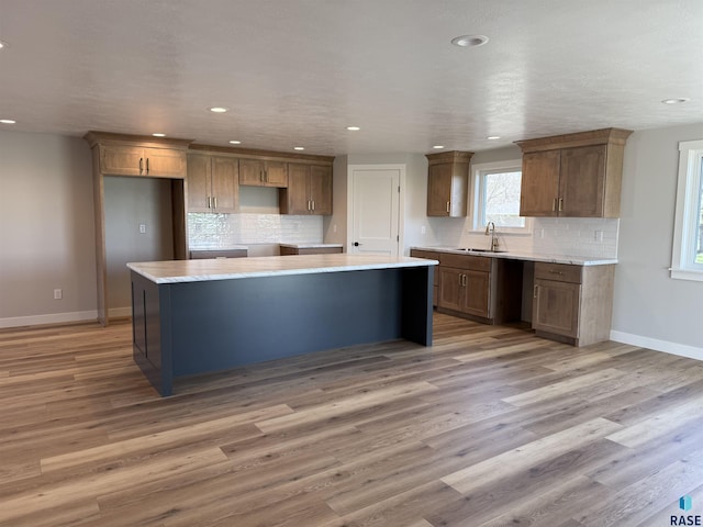 301 W 2nd St, Marion, SD 57043 - kitchen with decorative backsplash, recessed lighting, baseboards, and a center island