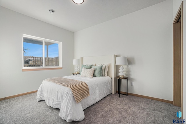 carpeted bedroom with baseboards