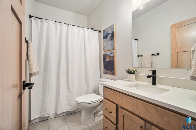 full bath with a shower with curtain, toilet, tile patterned flooring, and vanity