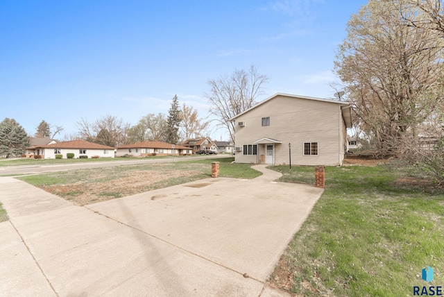 view of property exterior featuring a yard