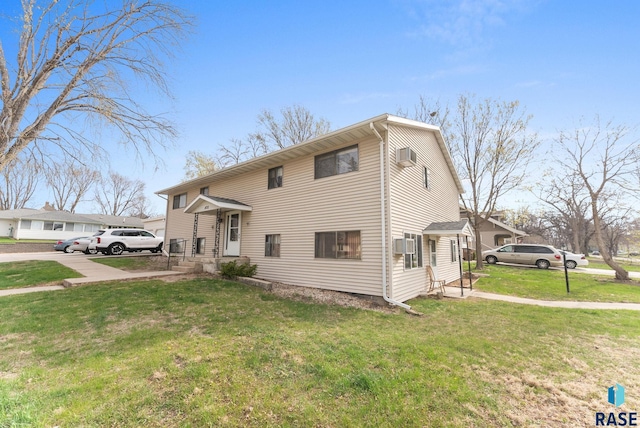 view of front of property with a front lawn