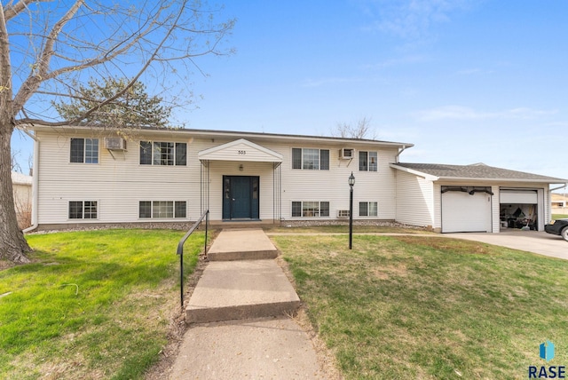 505 E 4th St, Canton, SD 57013 - bi-level home with a front lawn, driveway, and an attached garage