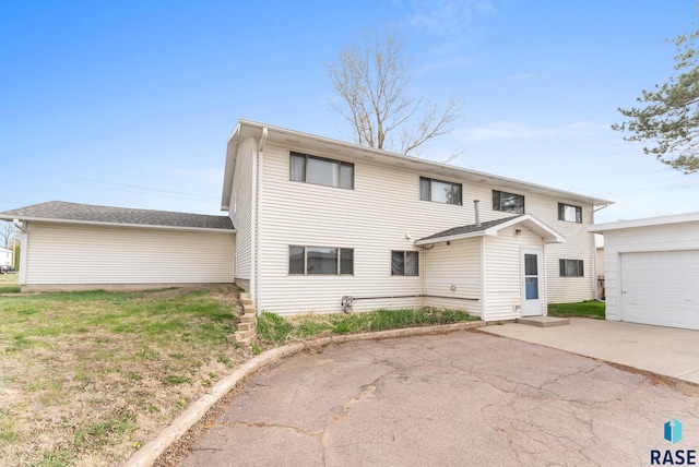 505 E 4th St, Canton, SD 57013 - view of front of house with concrete driveway and a garage
