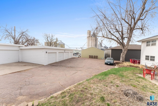 505 E 4th St, Canton, SD 57013 - exterior space featuring community garages