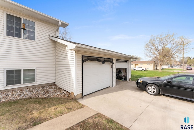 505 E 4th St, Canton, SD 57013 - view of side of property featuring a yard and concrete driveway