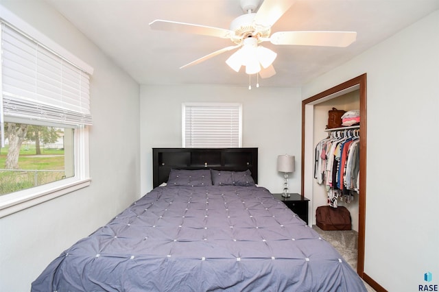 carpeted bedroom featuring a closet and ceiling fan