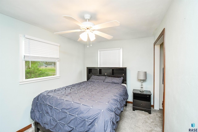 bedroom featuring carpet floors, baseboards, and a ceiling fan