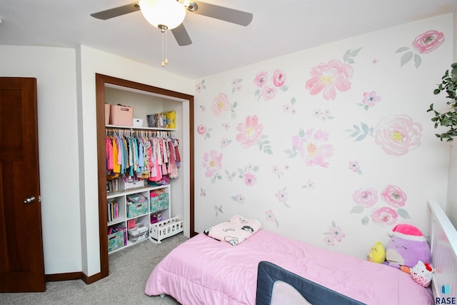 bedroom featuring baseboards, ceiling fan, carpet, and a closet