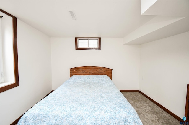 bedroom with baseboards, carpet flooring, and visible vents
