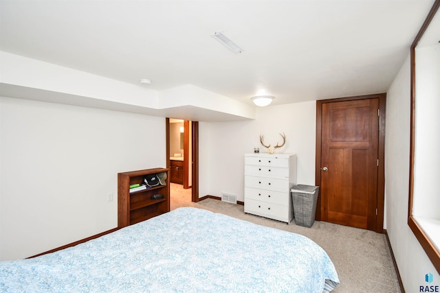 bedroom featuring light colored carpet, baseboards, and visible vents