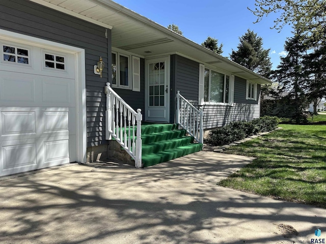 view of front facade featuring entry steps and an attached garage