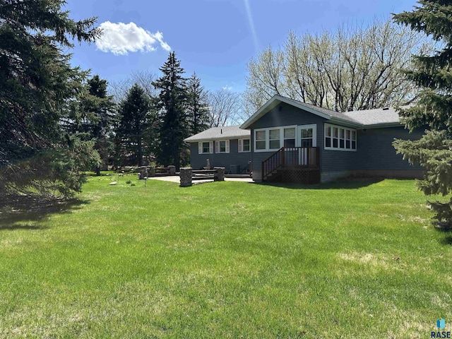 exterior space featuring a patio and a yard