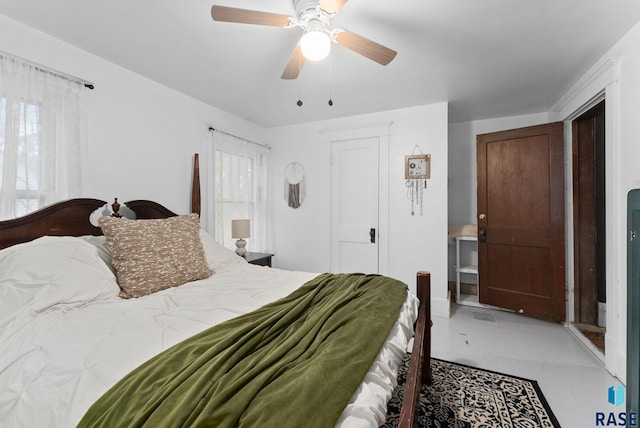 bedroom with finished concrete flooring and ceiling fan