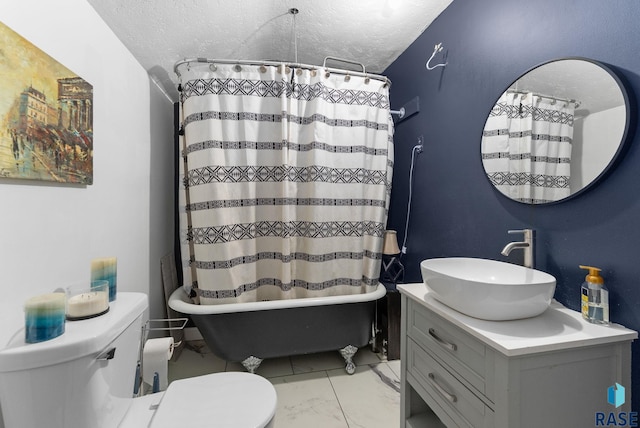 bathroom featuring vanity, marble finish floor, toilet, a textured ceiling, and shower / tub combo