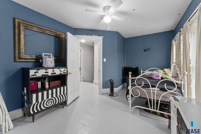 bedroom featuring baseboards and ceiling fan