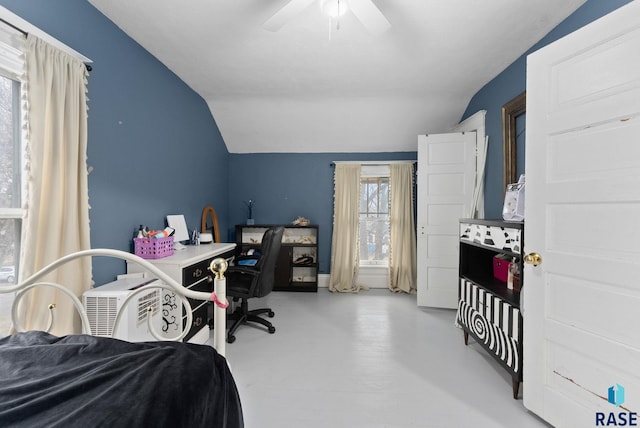 bedroom with finished concrete floors, ceiling fan, and vaulted ceiling