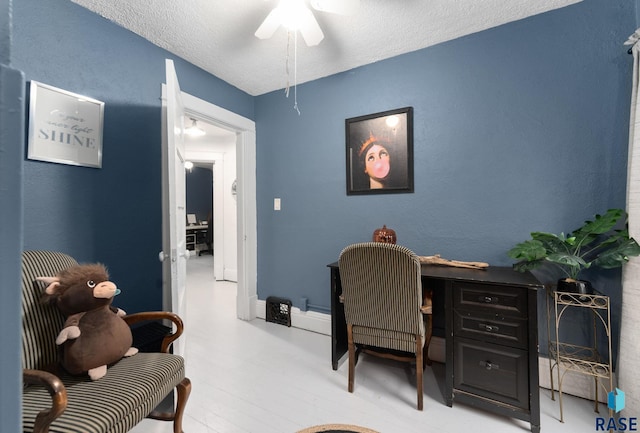 office area featuring a textured ceiling and ceiling fan