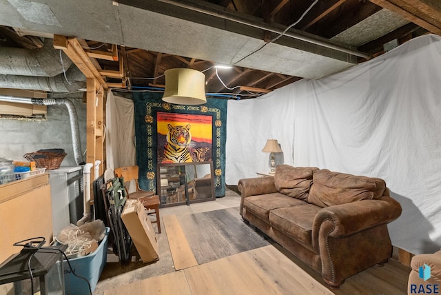 unfinished basement featuring wood finished floors
