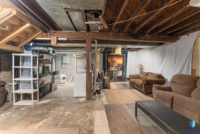 unfinished below grade area with washer / dryer