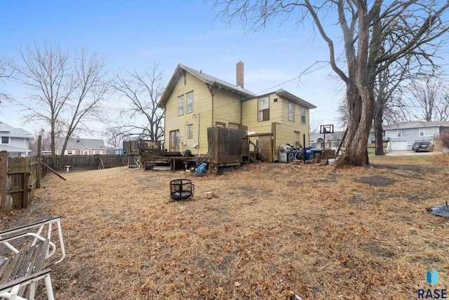 exterior space featuring a deck and fence