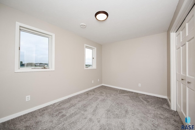 45442 275th St, Parker, SD 57053 - unfurnished bedroom featuring carpet floors, baseboards, and a closet