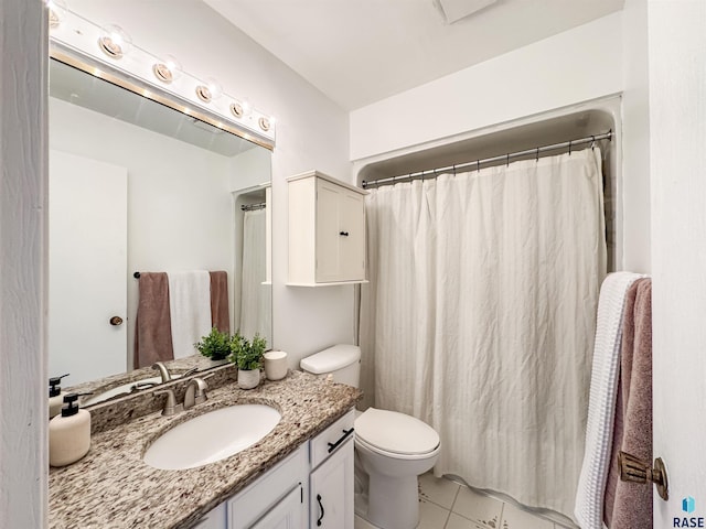 bathroom with a shower with curtain, tile patterned floors, vanity, and toilet