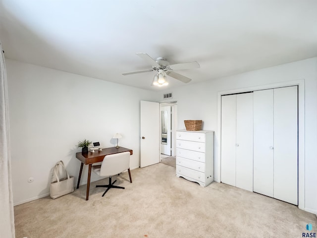 bedroom with ceiling fan, visible vents, light carpet, and a closet