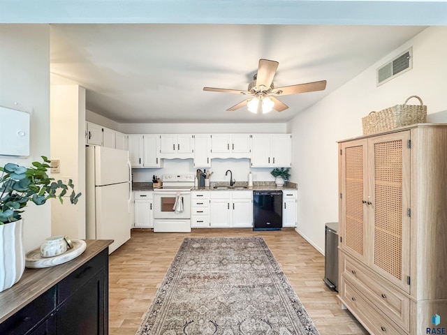 kitchen featuring a sink, light wood-type flooring, white appliances, and visible vents