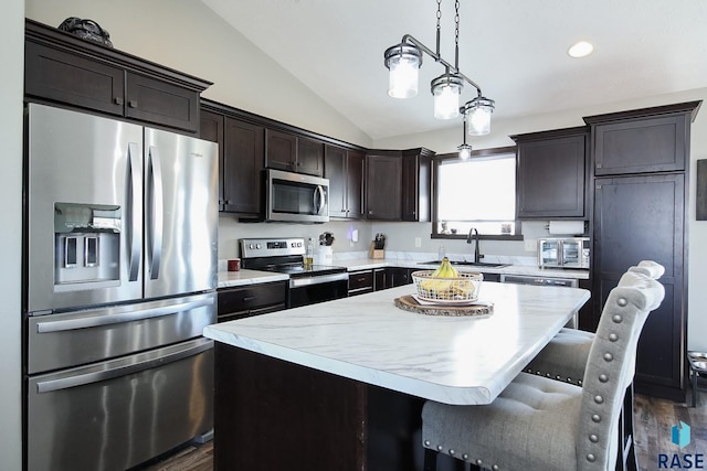 kitchen featuring a sink, stainless steel appliances, dark brown cabinetry, light countertops, and vaulted ceiling