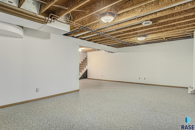 finished below grade area with stairs and baseboards