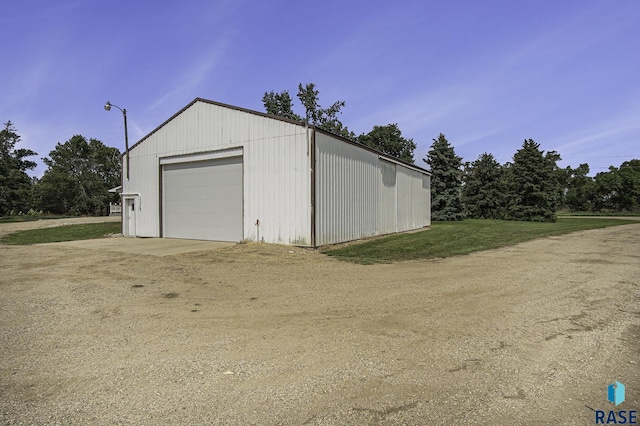 detached garage featuring driveway