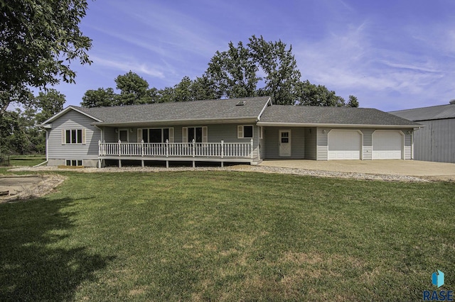 ranch-style house featuring an attached garage, a shingled roof, a front lawn, and concrete driveway
