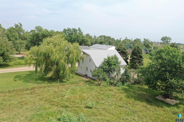 view of home's exterior with a lawn and stucco siding