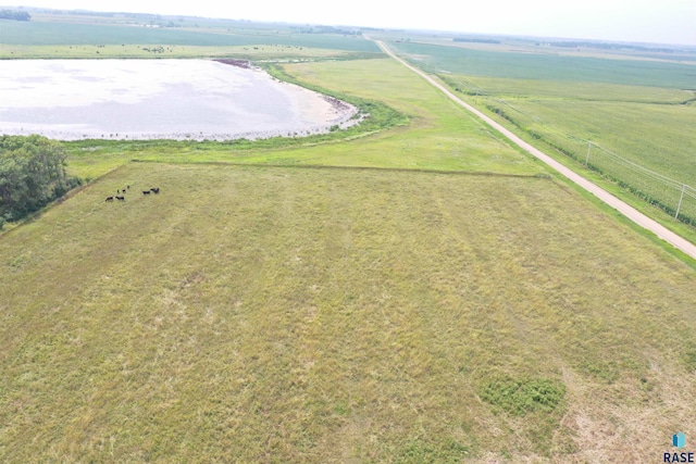 drone / aerial view featuring a water view and a rural view
