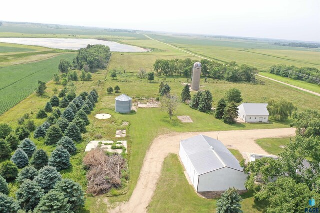 birds eye view of property with a rural view