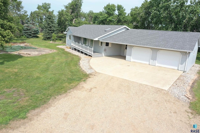 ranch-style home with a garage, a front lawn, a shingled roof, concrete driveway, and a porch