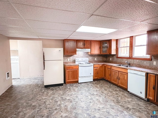120 SW 2nd St Unit 1 & 2, Wentworth, SD 57075 - kitchen with brown cabinetry, a sink, under cabinet range hood, a drop ceiling, and white appliances