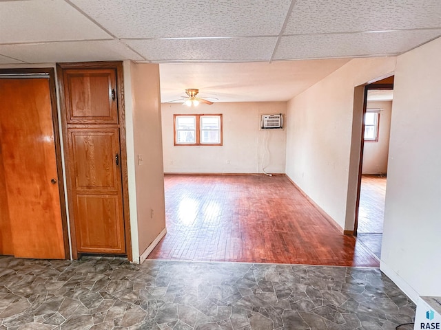 120 SW 2nd St Unit 1 & 2, Wentworth, SD 57075 - unfurnished room featuring a ceiling fan, a drop ceiling, and a wall mounted air conditioner