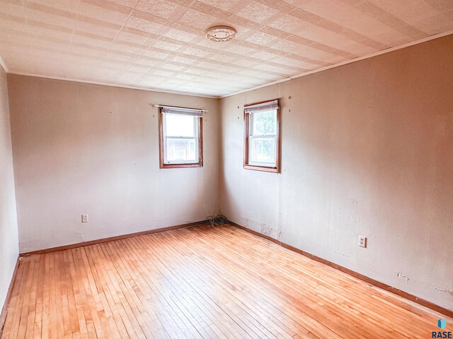 120 SW 2nd St Unit 1 & 2, Wentworth, SD 57075 - unfurnished room featuring baseboards and hardwood / wood-style floors