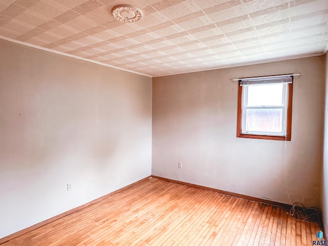 120 SW 2nd St Unit 1 & 2, Wentworth, SD 57075 - unfurnished room with baseboards and hardwood / wood-style flooring