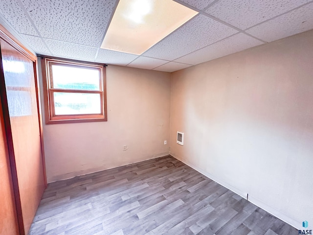 120 SW 2nd St Unit 1 & 2, Wentworth, SD 57075 - empty room featuring visible vents, a drop ceiling, and wood finished floors